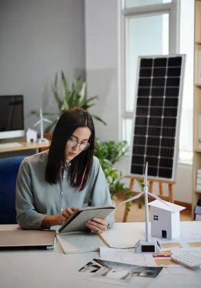 Sia Engineering team member reviewing solar panel